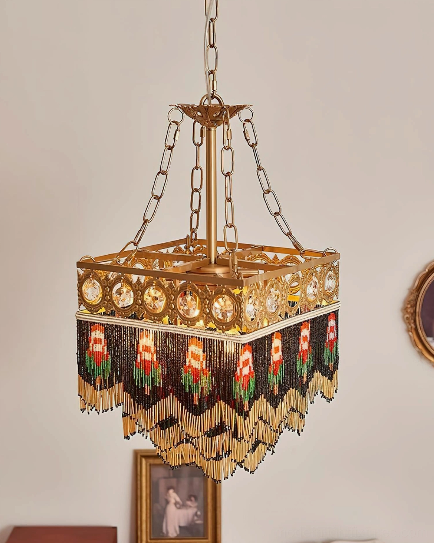 Vintage tassel chandelier suspended in bohemian interior with gallery wall artwork