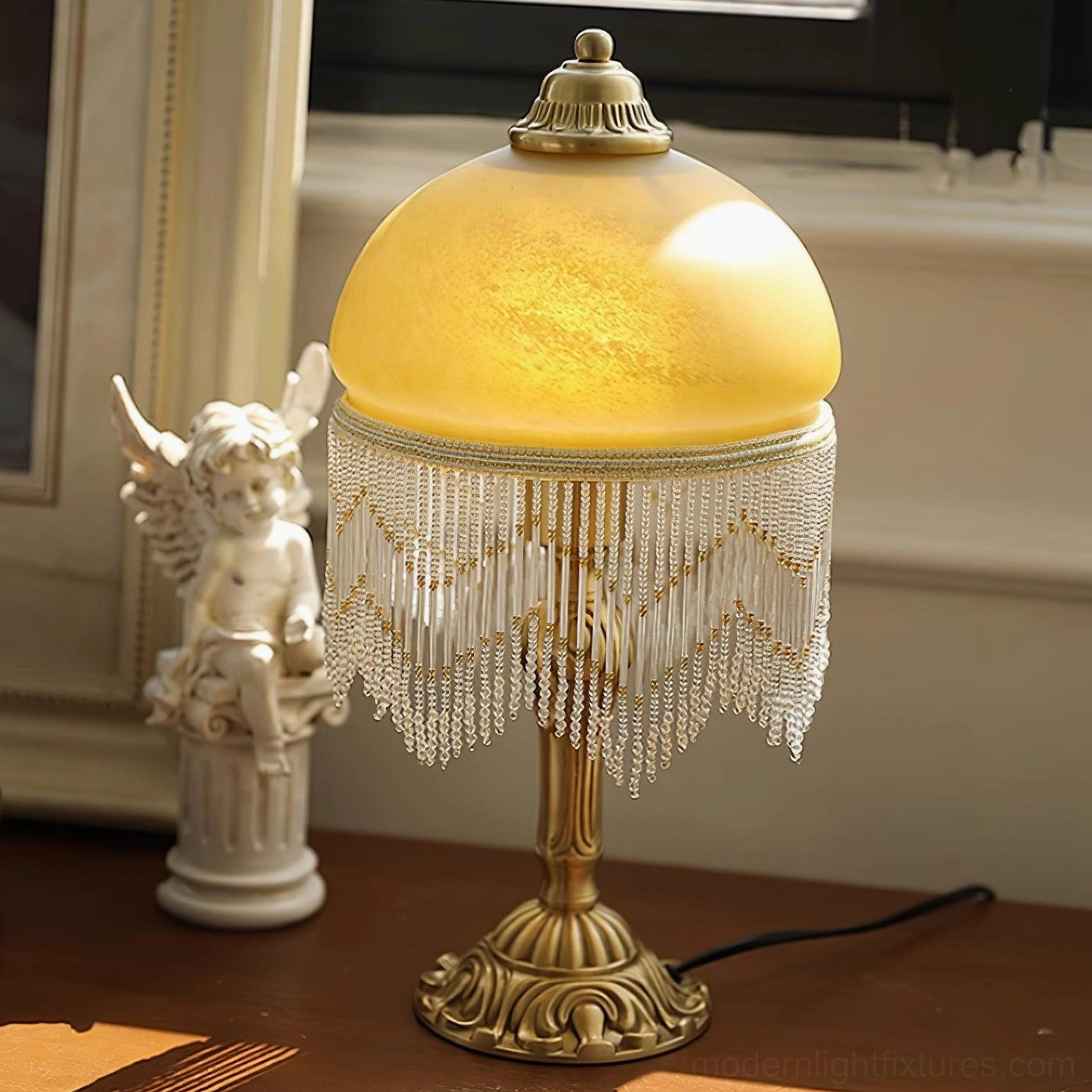 Vintage brass tassel table lamp with warm golden brass finish and detailed carved pedestal base
