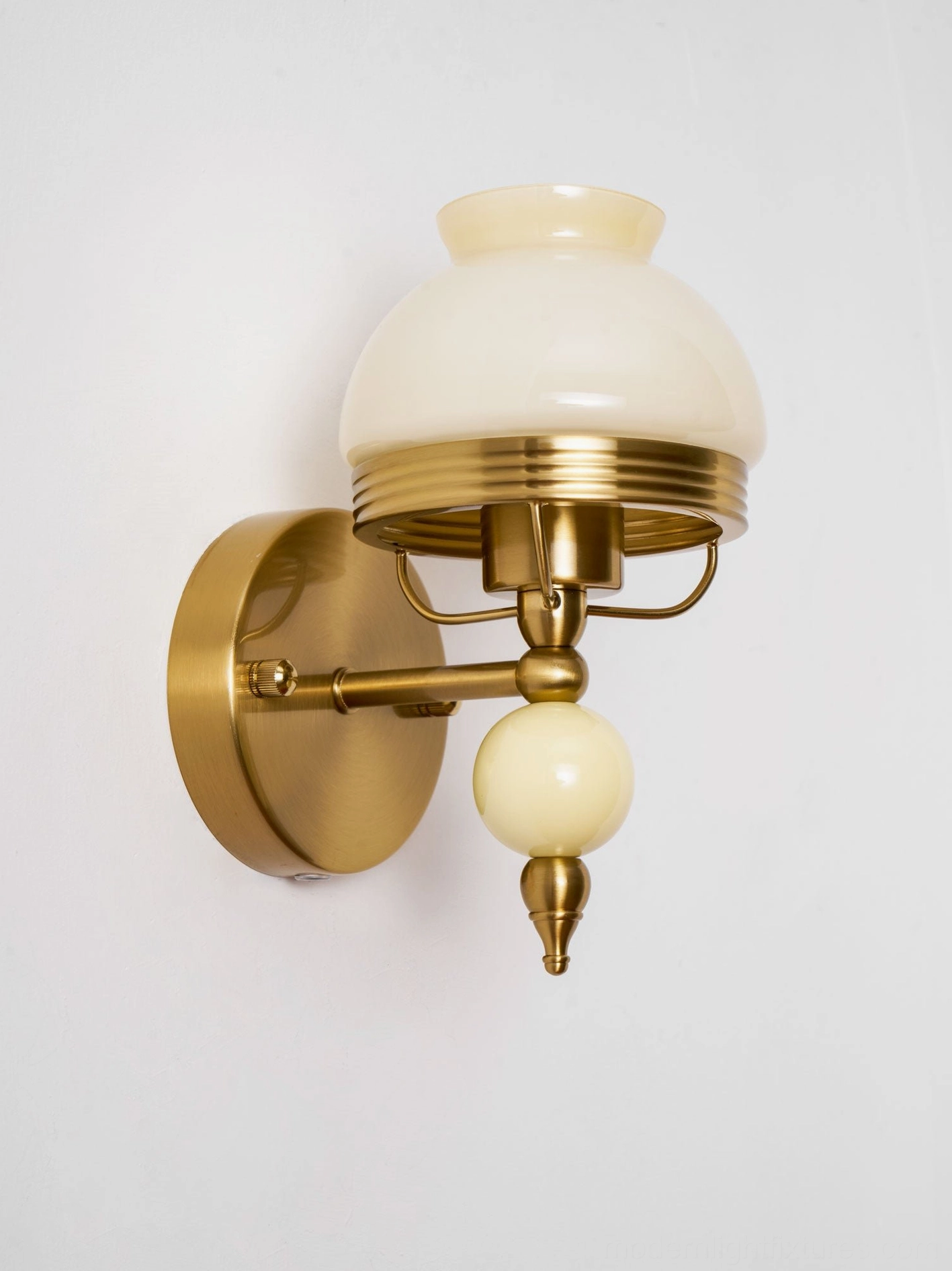 Vintage wall sconce with soft beige frosted glass and delicate floral etching
