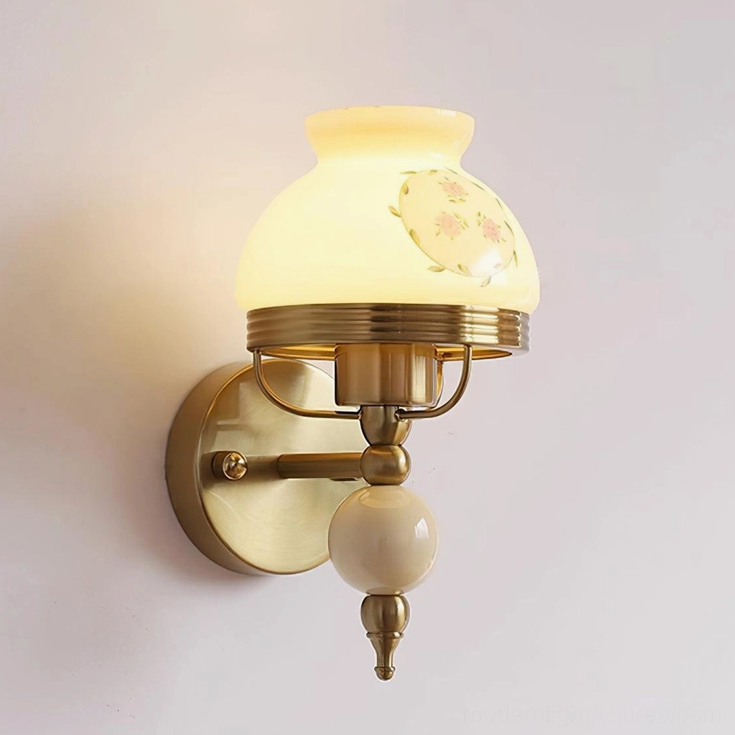 Vintage wall sconce with decorative frosted glass and ceramic detail in home setting