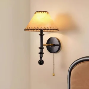 Vintage wood wall lamp with dark wooden arm and beige stitched fabric shade, three-quarter angle