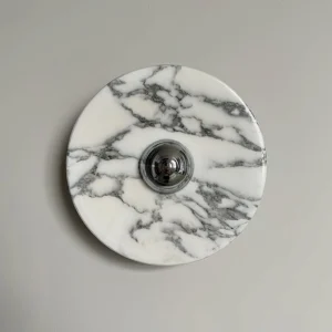 Viola modern marble wall lamp close-up detail showing circular disc design and polished chrome center