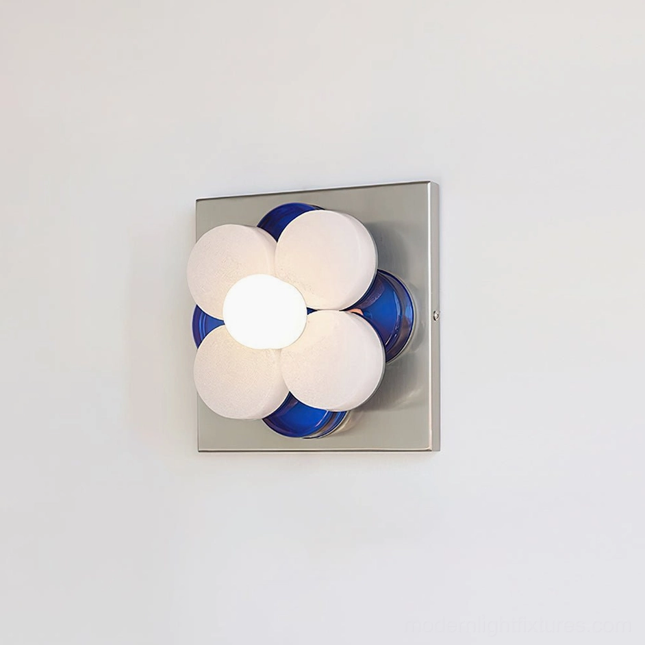 Violetta wall lamp three-quarter view showing spherical white frosted glass petals with blue underside accents and chrome square base