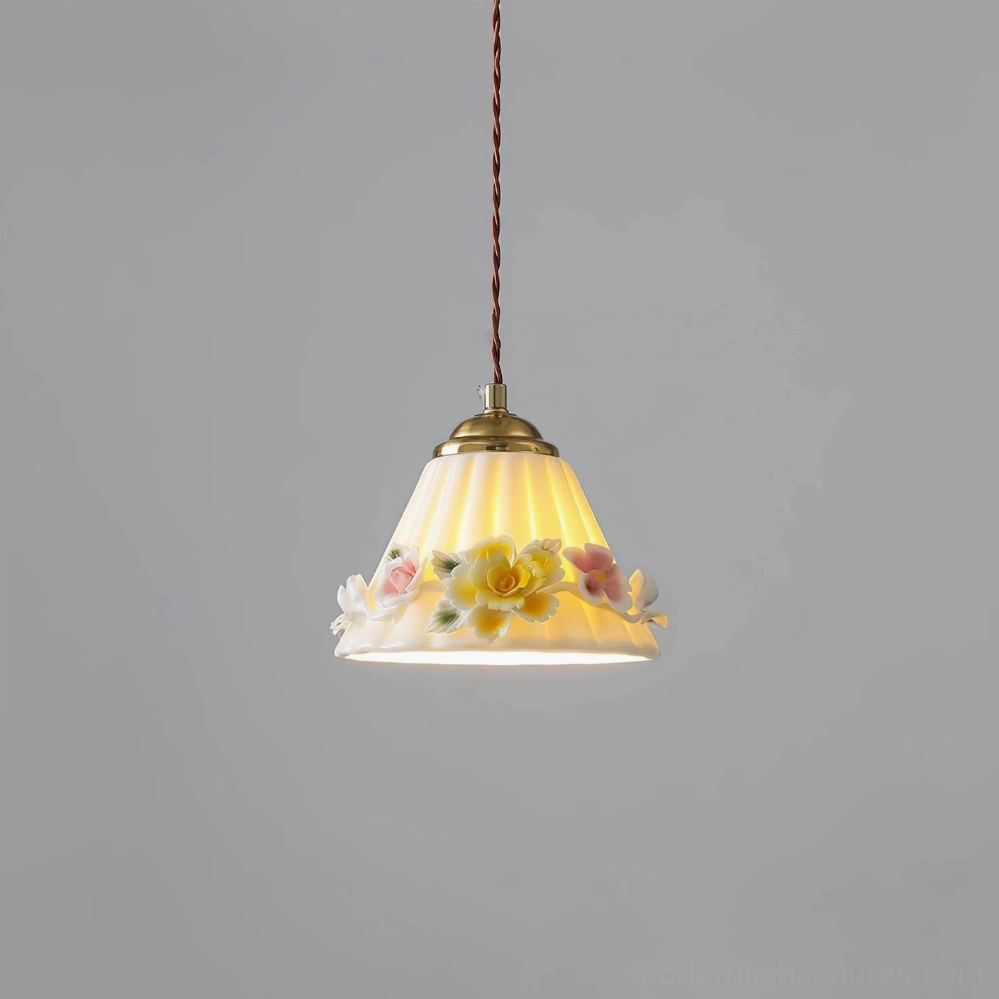 Vionna Model A small pendant lamp with brass bow and ceramic shade for intimate spaces