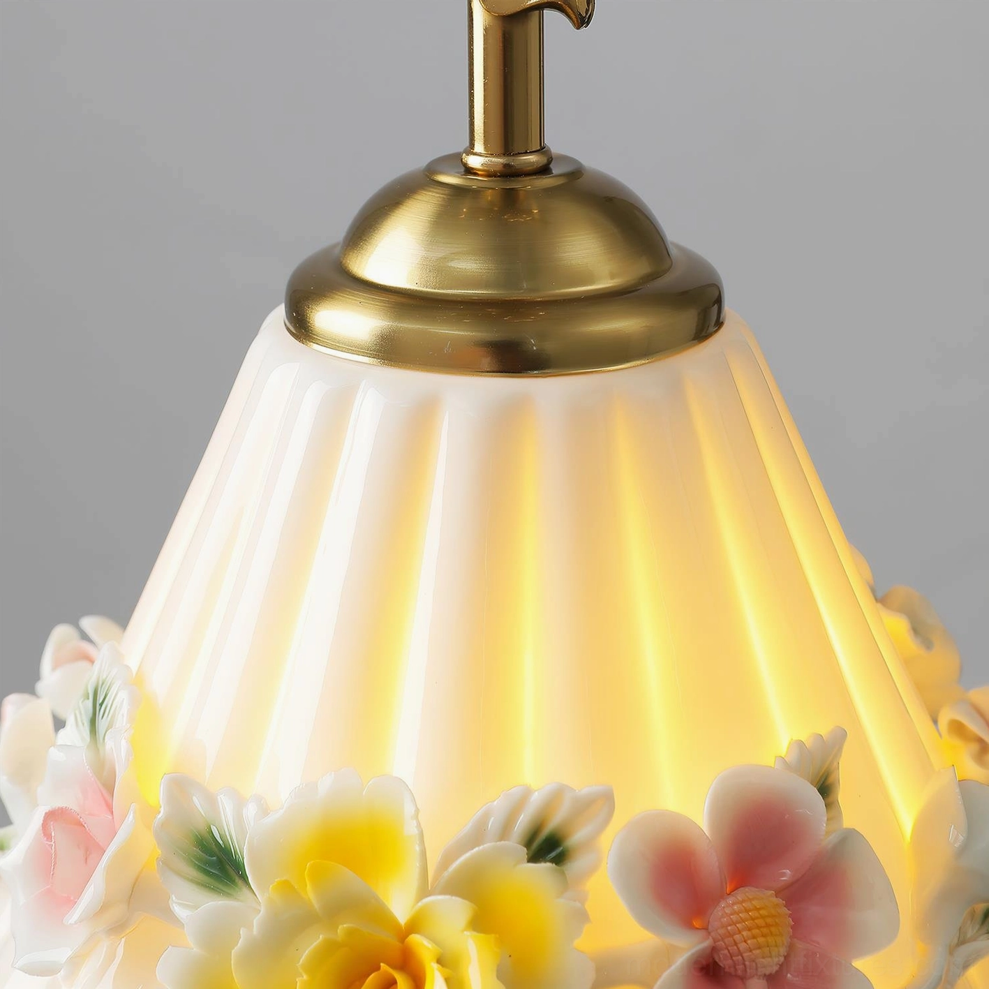 Vionna pendant lamp full assembled view showing ceramic shade, brass hardware, and wire length
