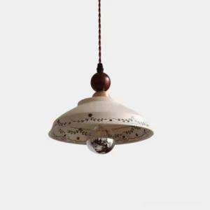 Virella ceramic pendant light with botanical floral pattern and brass wood accents, studio view on white background