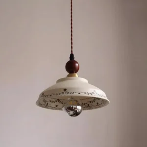 Virella floral ceramic pendant lamp with exposed E26 bulb and twisted fabric cord, close-up detail view