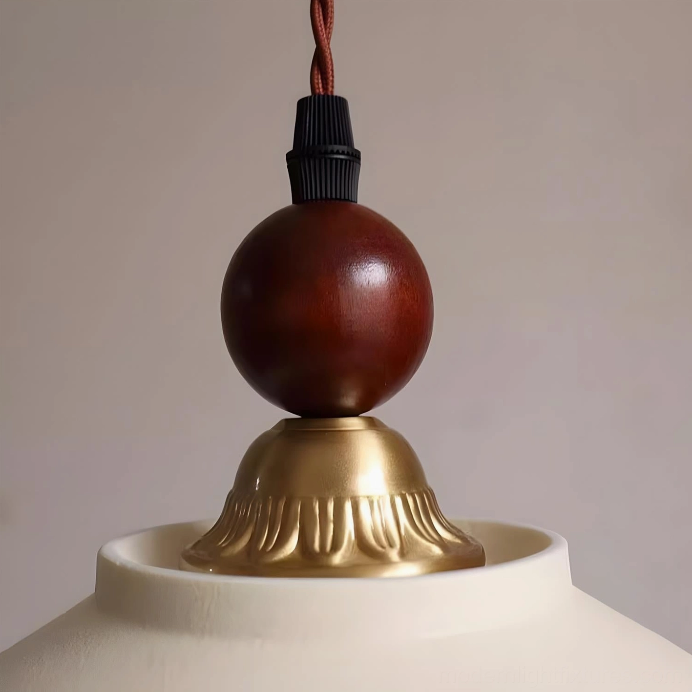 Virella botanical ceramic pendant light featuring floral pattern edge detail, twisted fabric cord, and warm brass accents