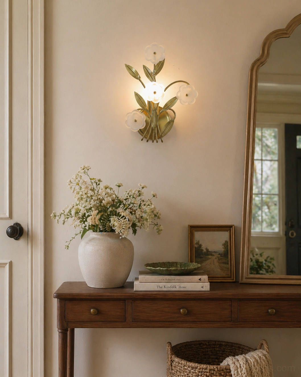 Virella floral wall sconce mounted in vintage entryway beside wooden console table, arched mirror and vase