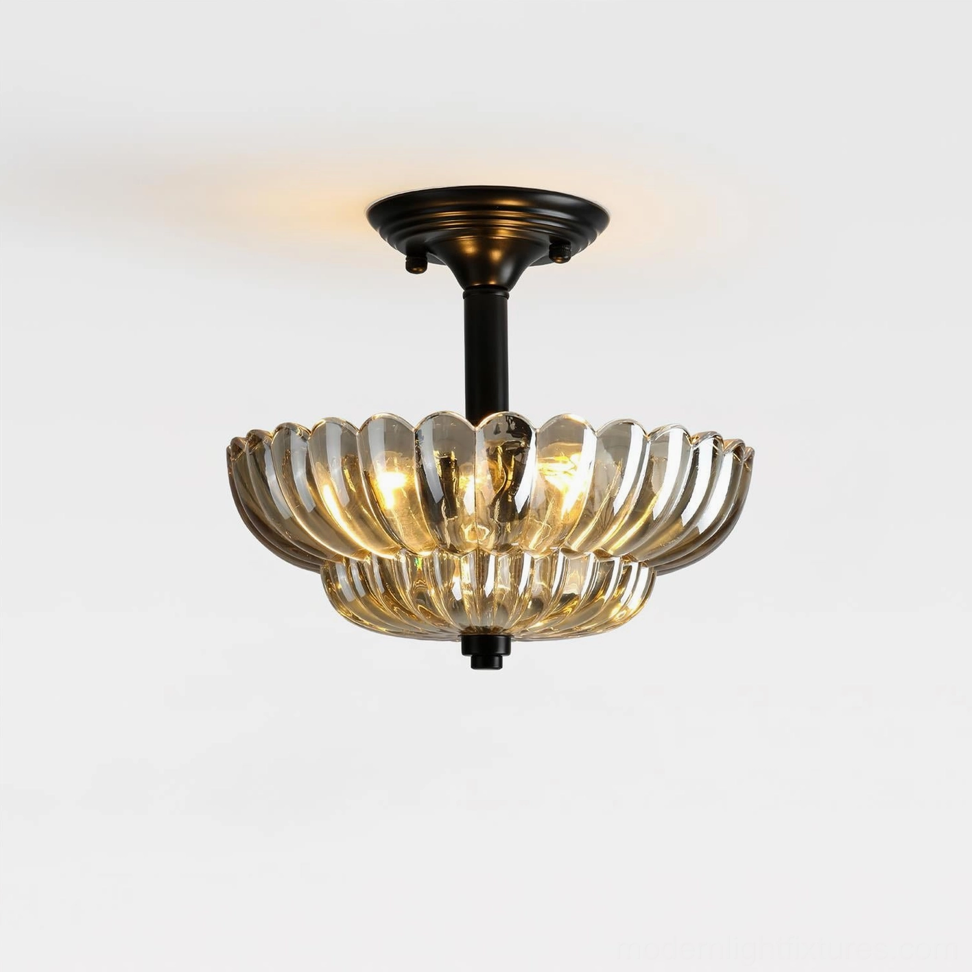 Virenza petal ceiling light fixture with clear amber scalloped glass shade and matte black base, studio front view