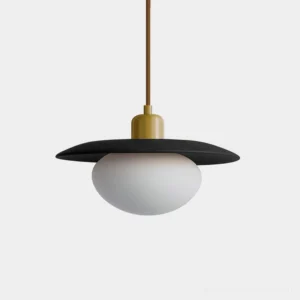 Vireo black wood pendant light with brass hardware and frosted white glass globe, front studio view