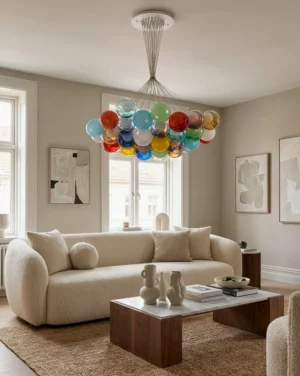 Vivelle cluster pendant chandelier hanging in modern minimalist living room with jewel-tone glass globes providing warm ambient lighting above neutral seating