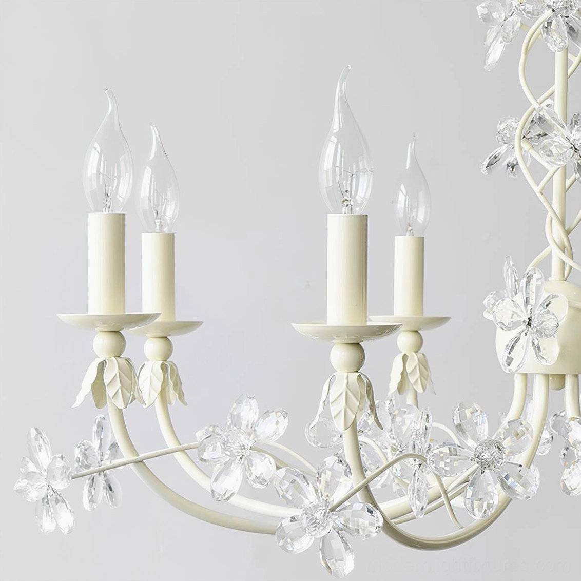 Vivette floral chandelier close-up showing crystal glass flower petals and ivory metal frame construction