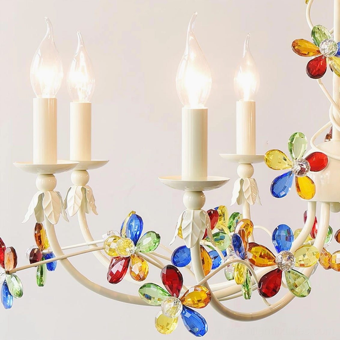 Vivette floral crystal chandelier with palm plant decor in elegant residential interior setting