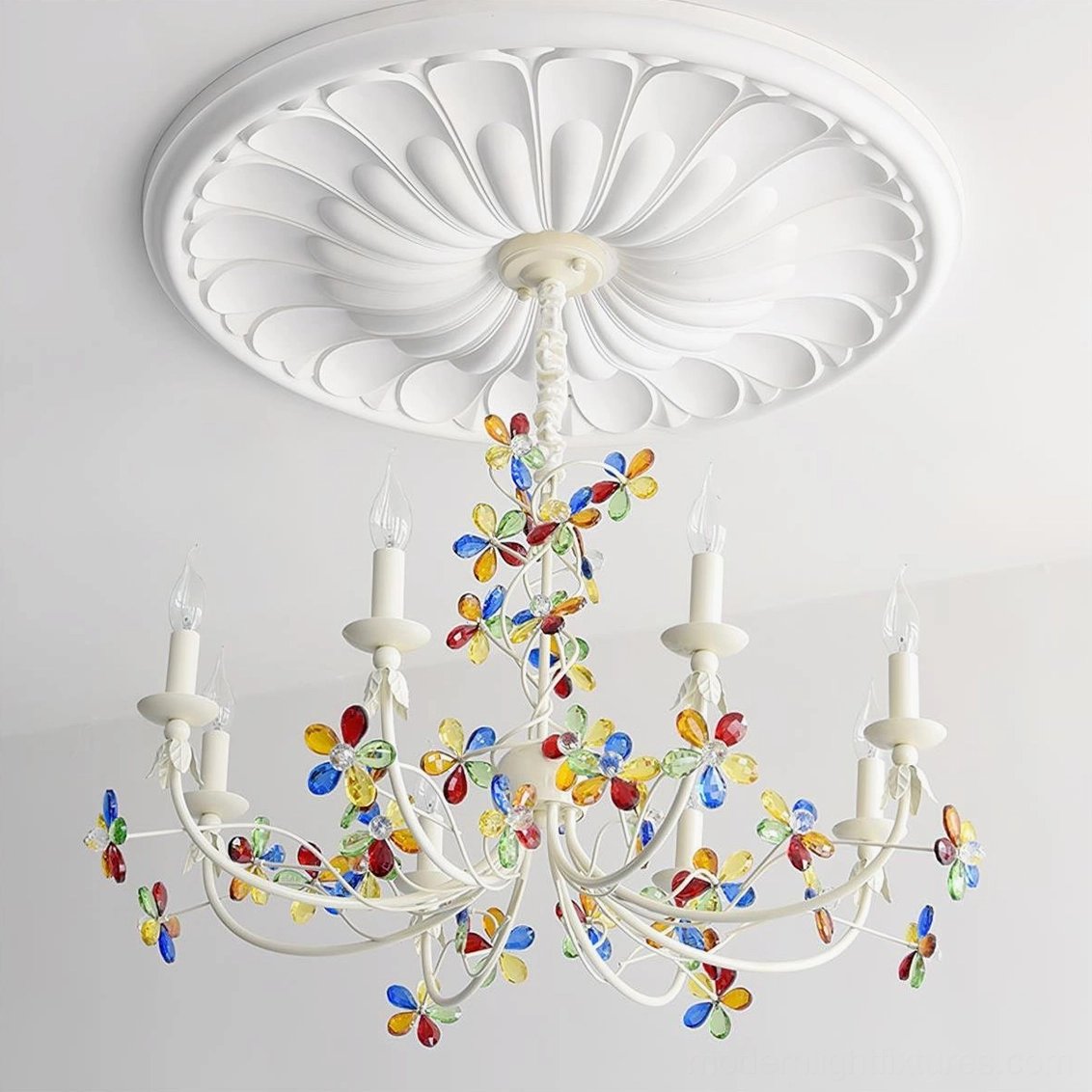 Vivette chandelier mounted on carved ceiling medallion with clear and multicolored glass accents in residential space