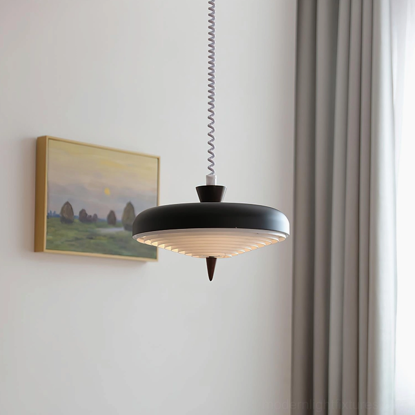 Contemporary black ribbed pendant light hanging in modern living space with gray curtains and wall art