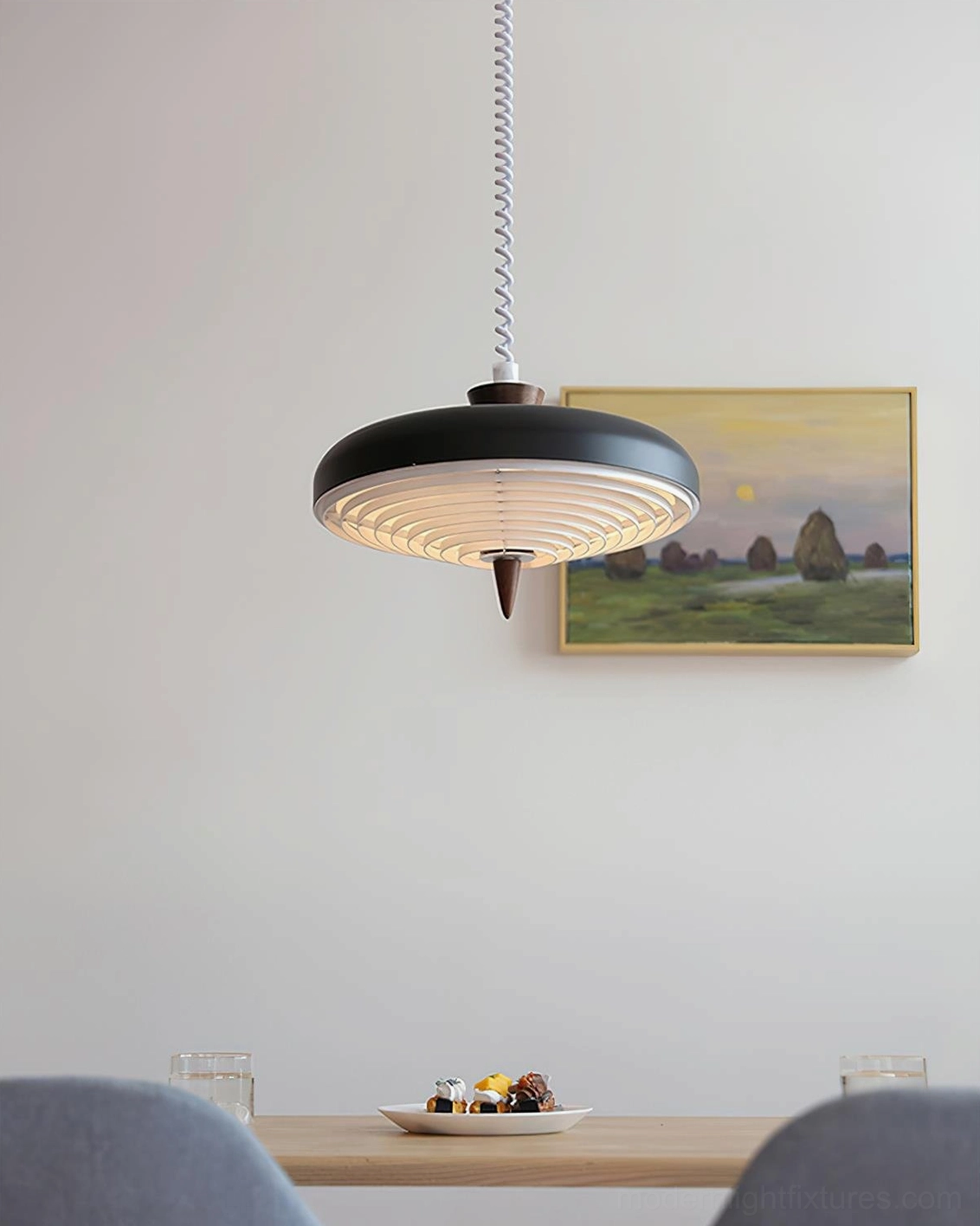 Vortex Spiral Pendant Light in neutral tone with abstract wall art, modern minimalist interior design