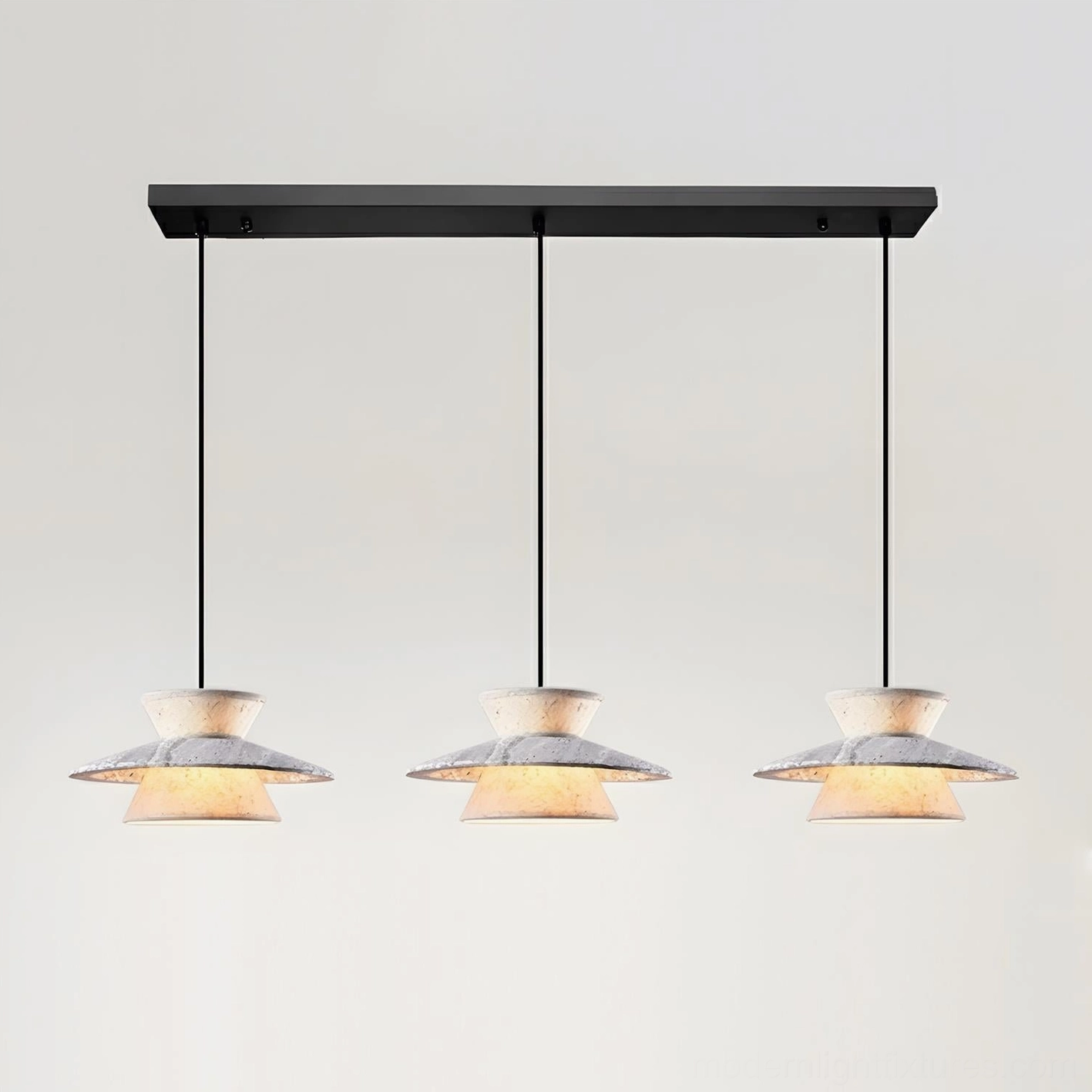 3-head Vortin linear pendant light in grey and white creating sculptural focal point over long dining table