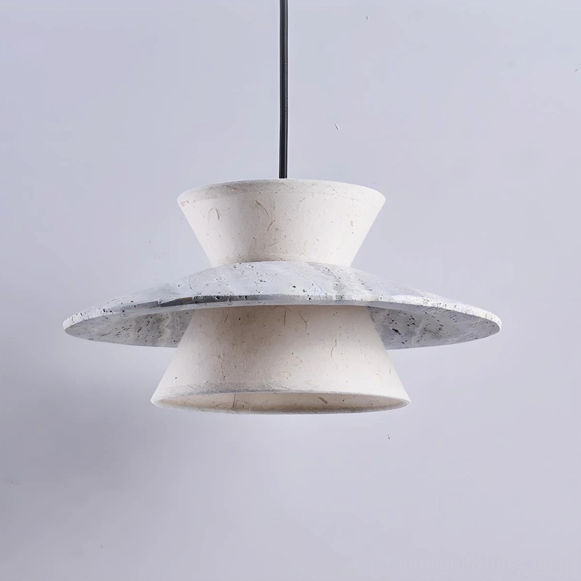 Vortin modern sculptural pendant lamp demonstrating travertine finish and minimalist architectural form