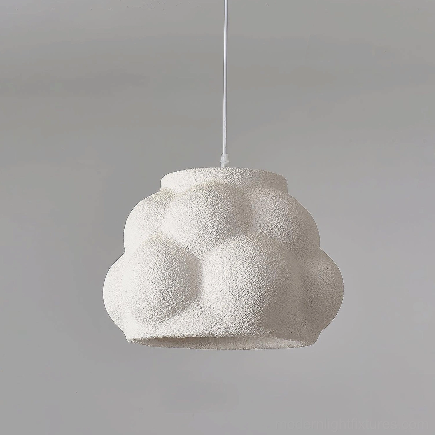 Matte finish wabi-sabi cloud pendant lamp showing organic bumpy polystyrene surface
