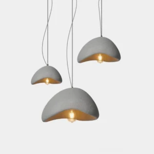 Wabi-Sabi pendant chandelier with grey matte dome finish hanging in minimalist studio setting