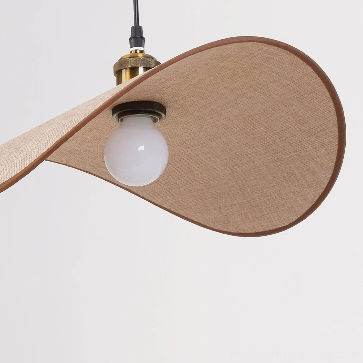 Handcrafted wabi-sabi pendant light showing irregular flared shade silhouette and artisanal fabric detailing