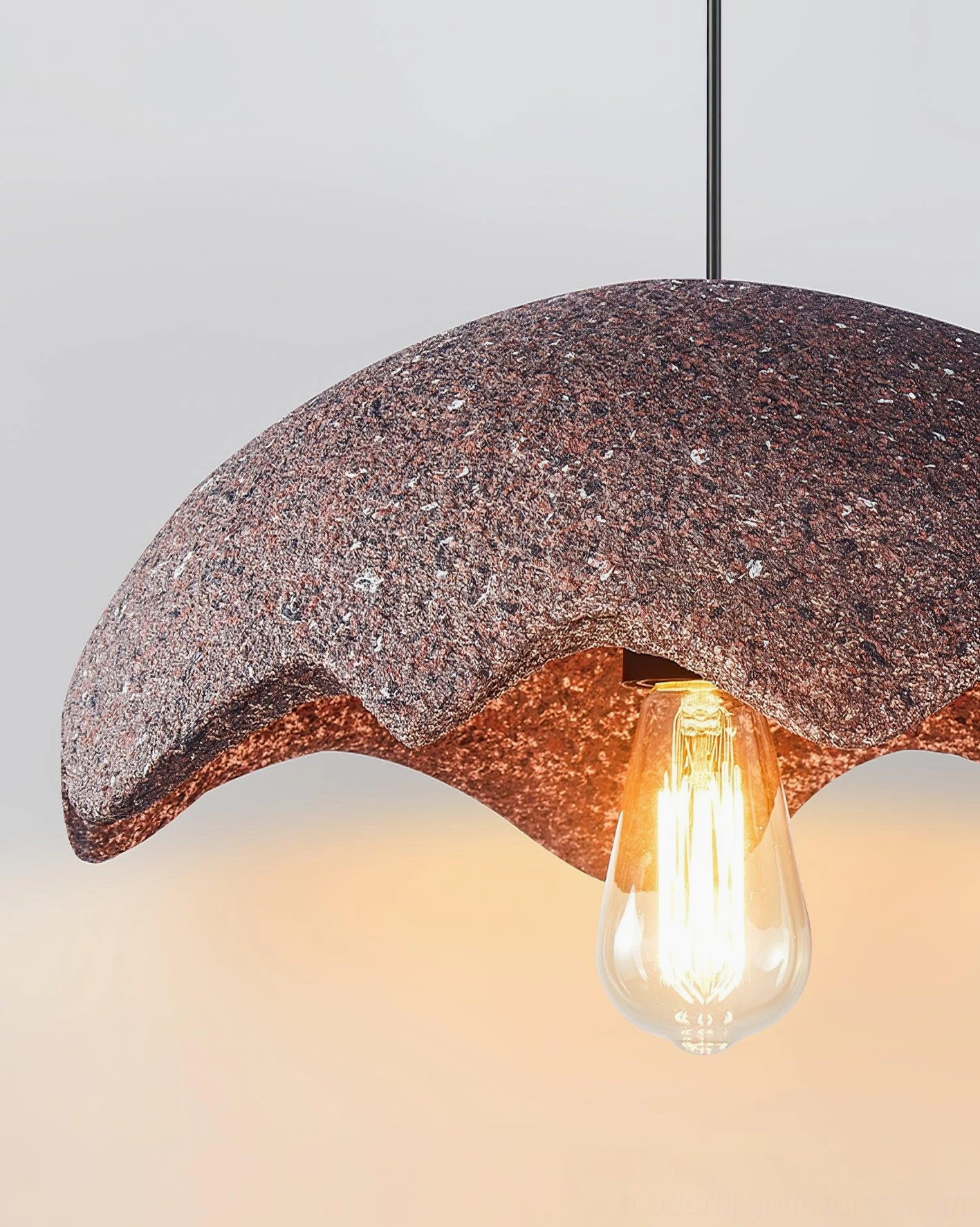 Wabi-sabi scalloped pendant light with asymmetrical design celebrating imperfect beauty