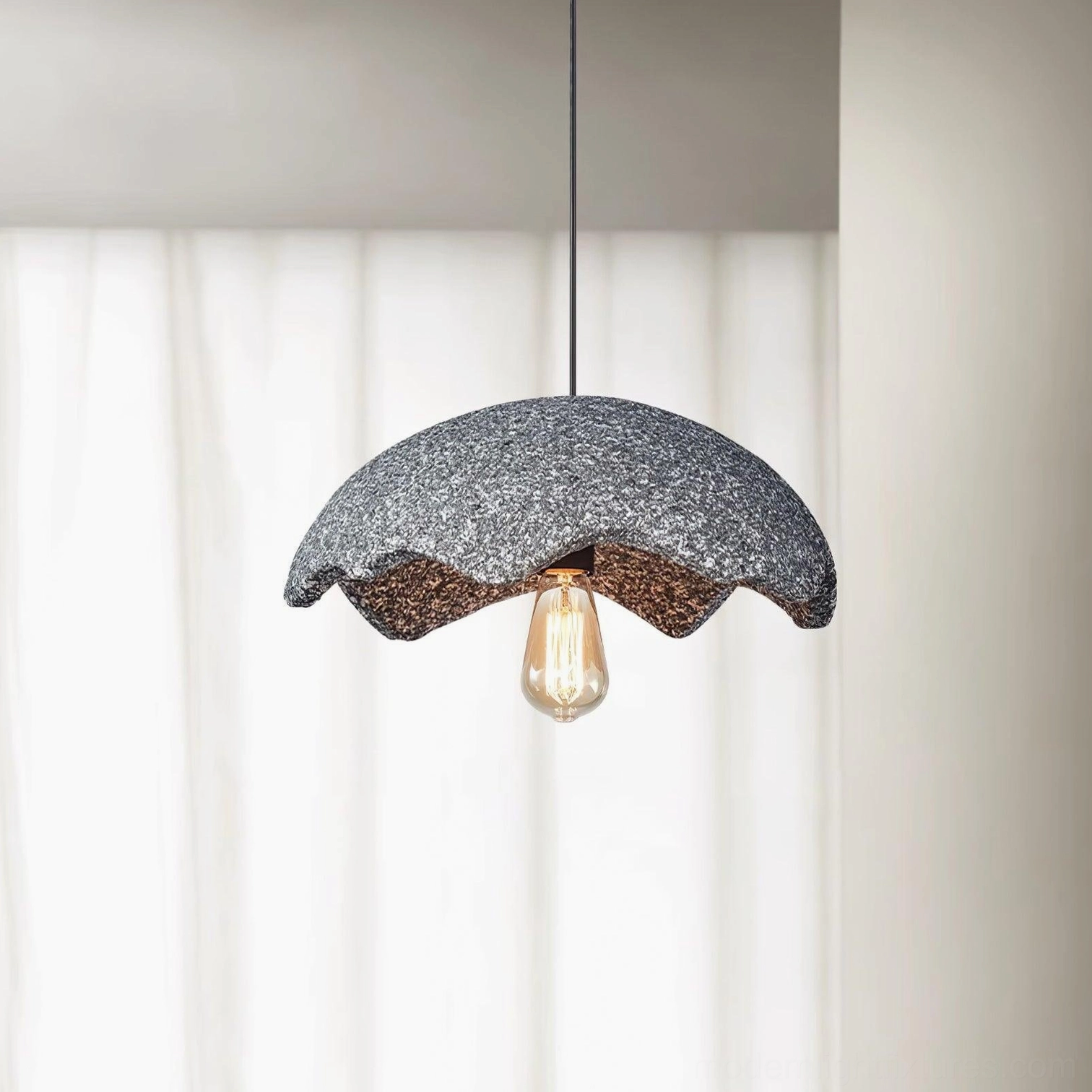 Dark gray wabi-sabi scalloped pendant light with textured shade and warm Edison bulb glow