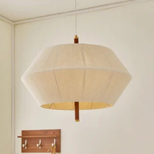 Japanese-inspired fabric pendant light in residential interior corner with warm ambient lighting