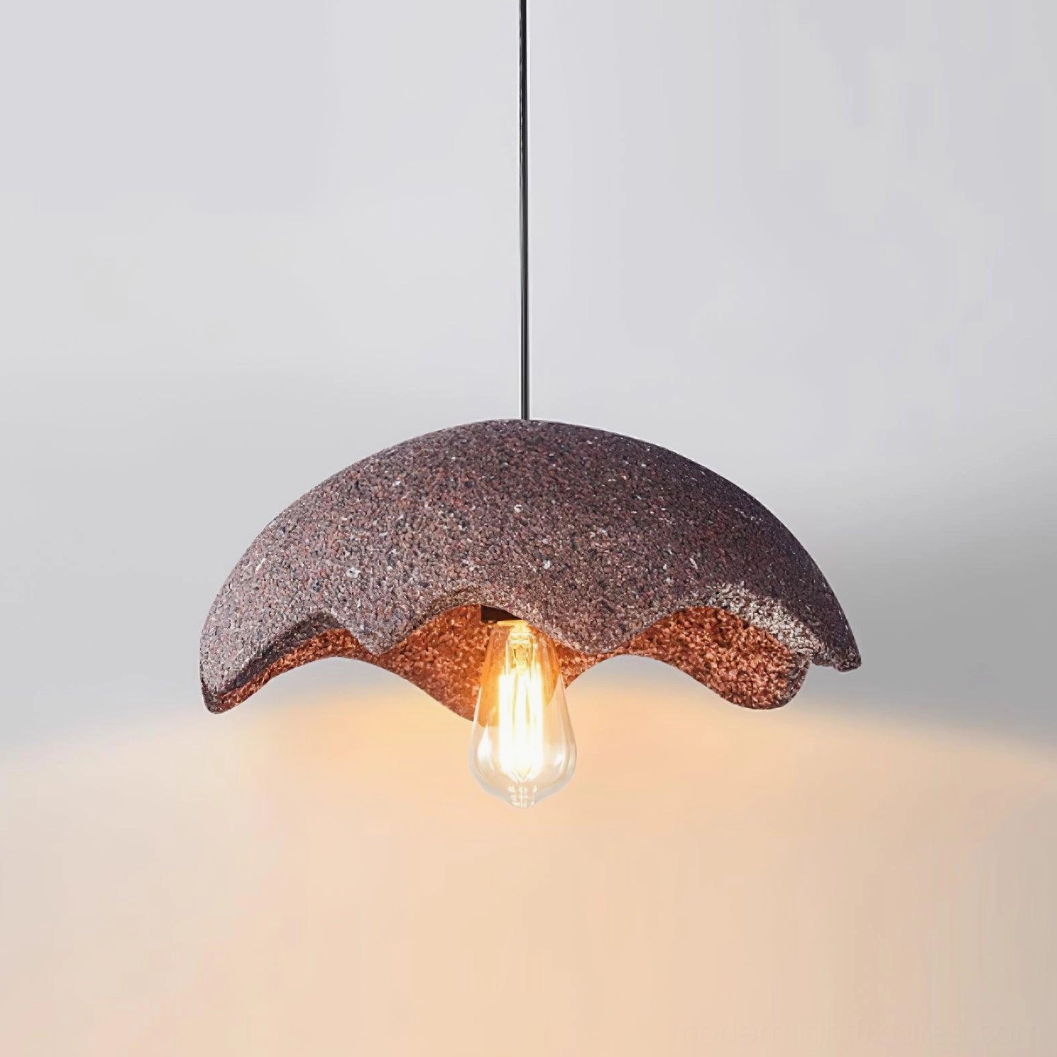 Red wabi-sabi scalloped pendant light with exposed vintage Edison bulb in contemporary home