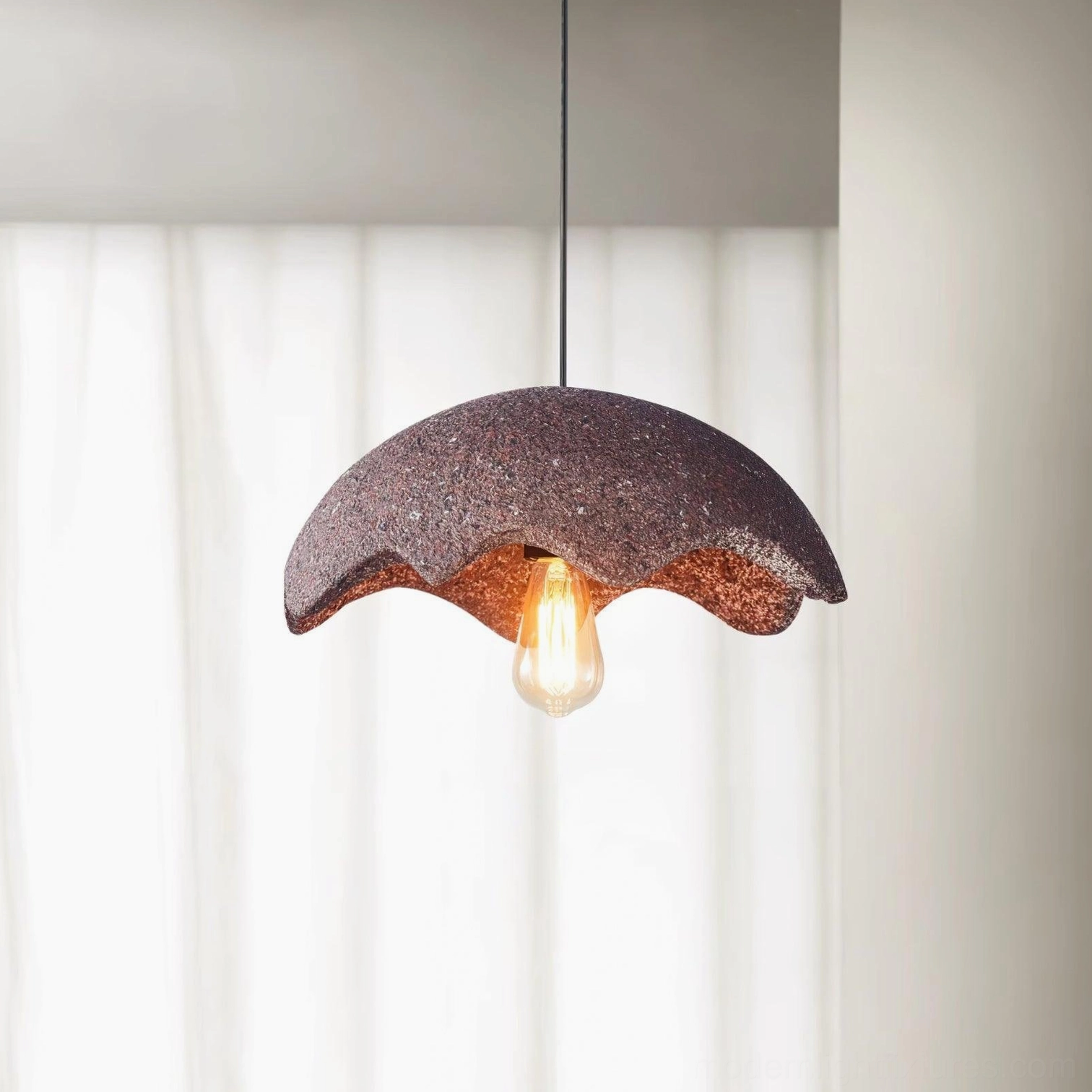 Wabi-sabi pendant light in red with speckled ceramic texture on white curtain backdrop