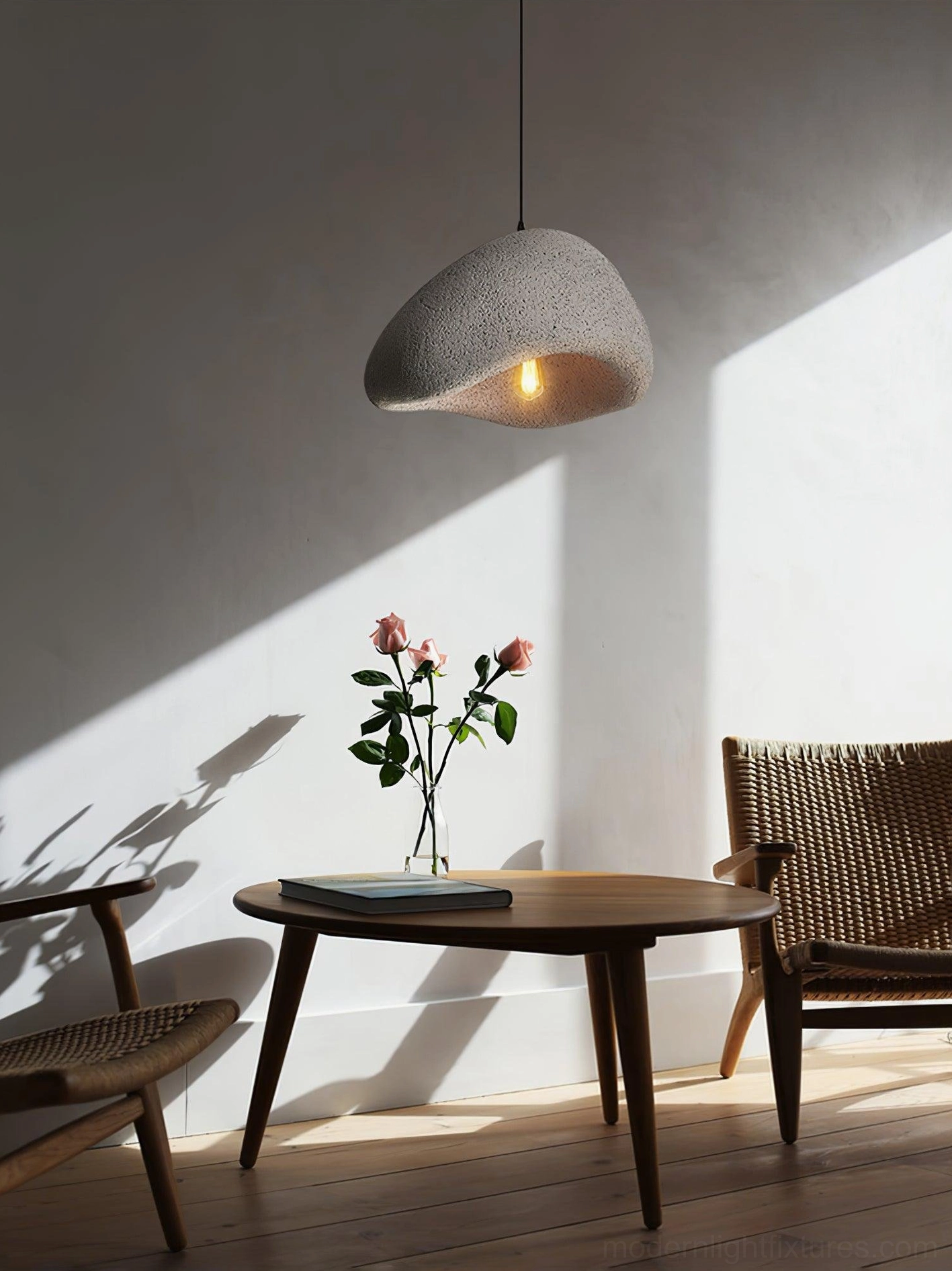 Wabi-sabi chandelier with round canopy in contemporary minimalist interior design space
