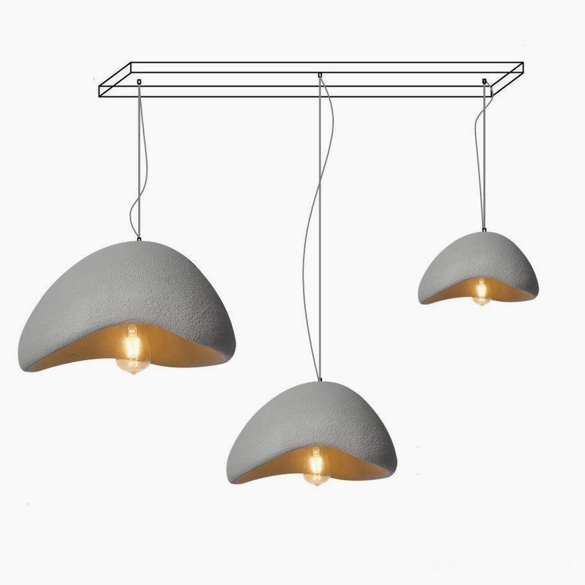 Wabi-sabi three-light pendant chandelier creating focal point in modern dining area