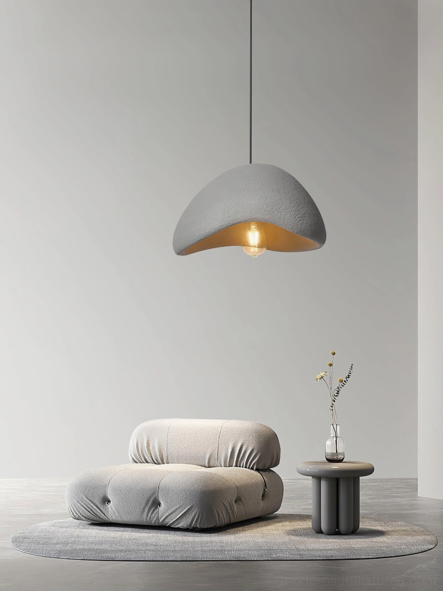 White wabi-sabi chandelier creating soft illumination in Japandi bedroom and relaxation area
