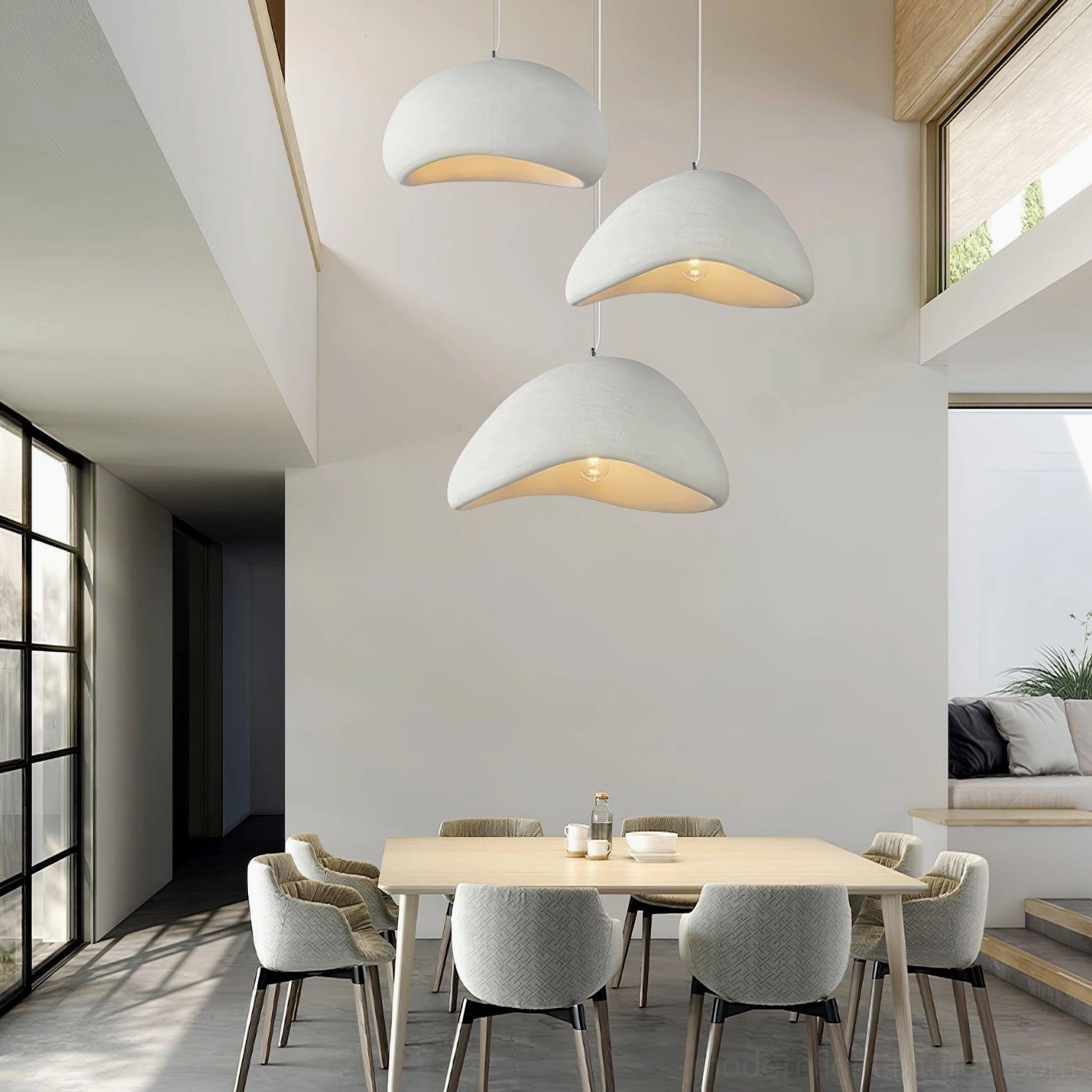 Multi-drop wabi-sabi chandelier with off-white matte finish in contemporary dining room with warm ambient lighting