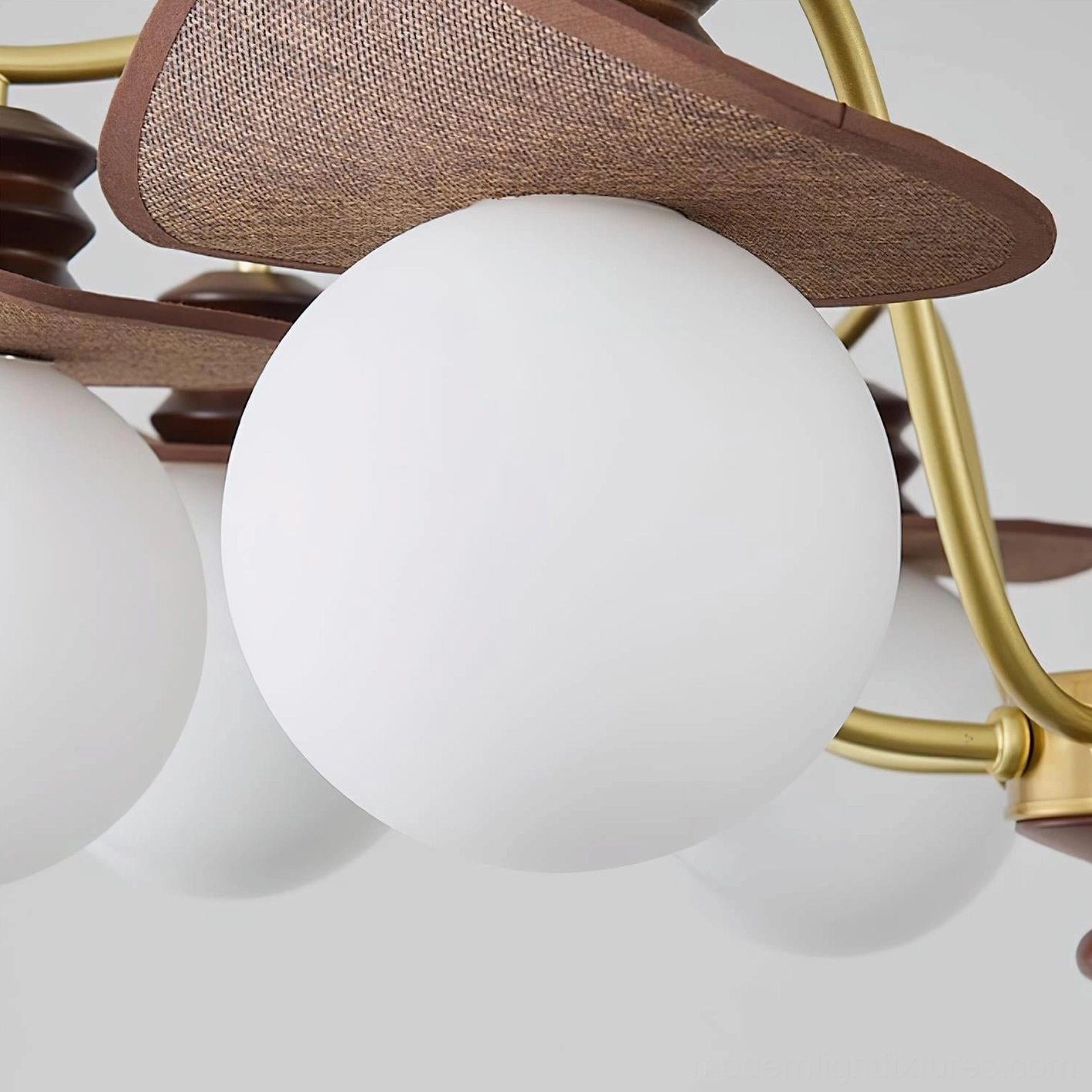 Walden modern chandelier with gold and walnut color finish in styled interior room setting