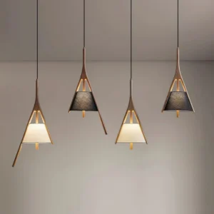 Multiple Waldo pendant lights installed together displaying solid wood triangular frames tapered silhouette