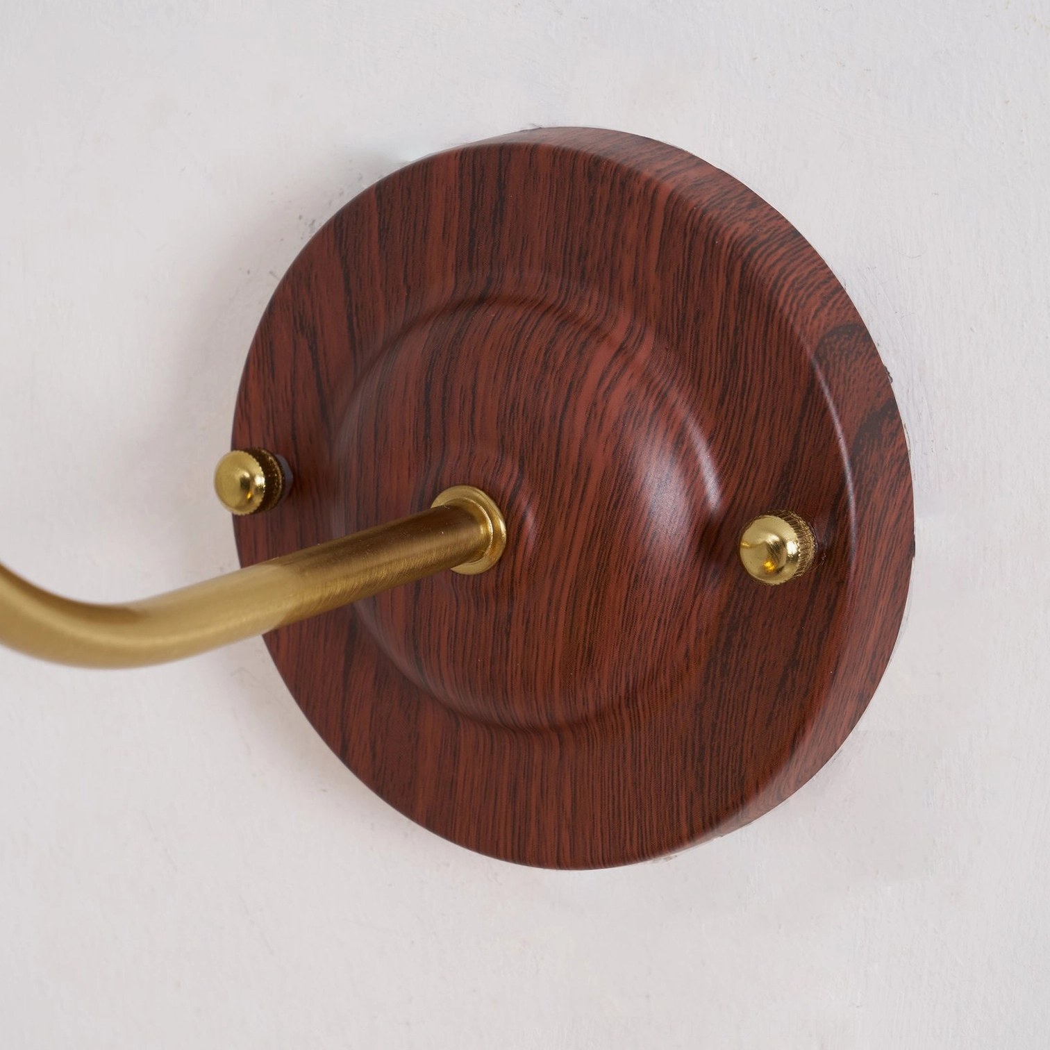 Nalia wall lamp detail view of metal frame and mounting hardware showing professional construction