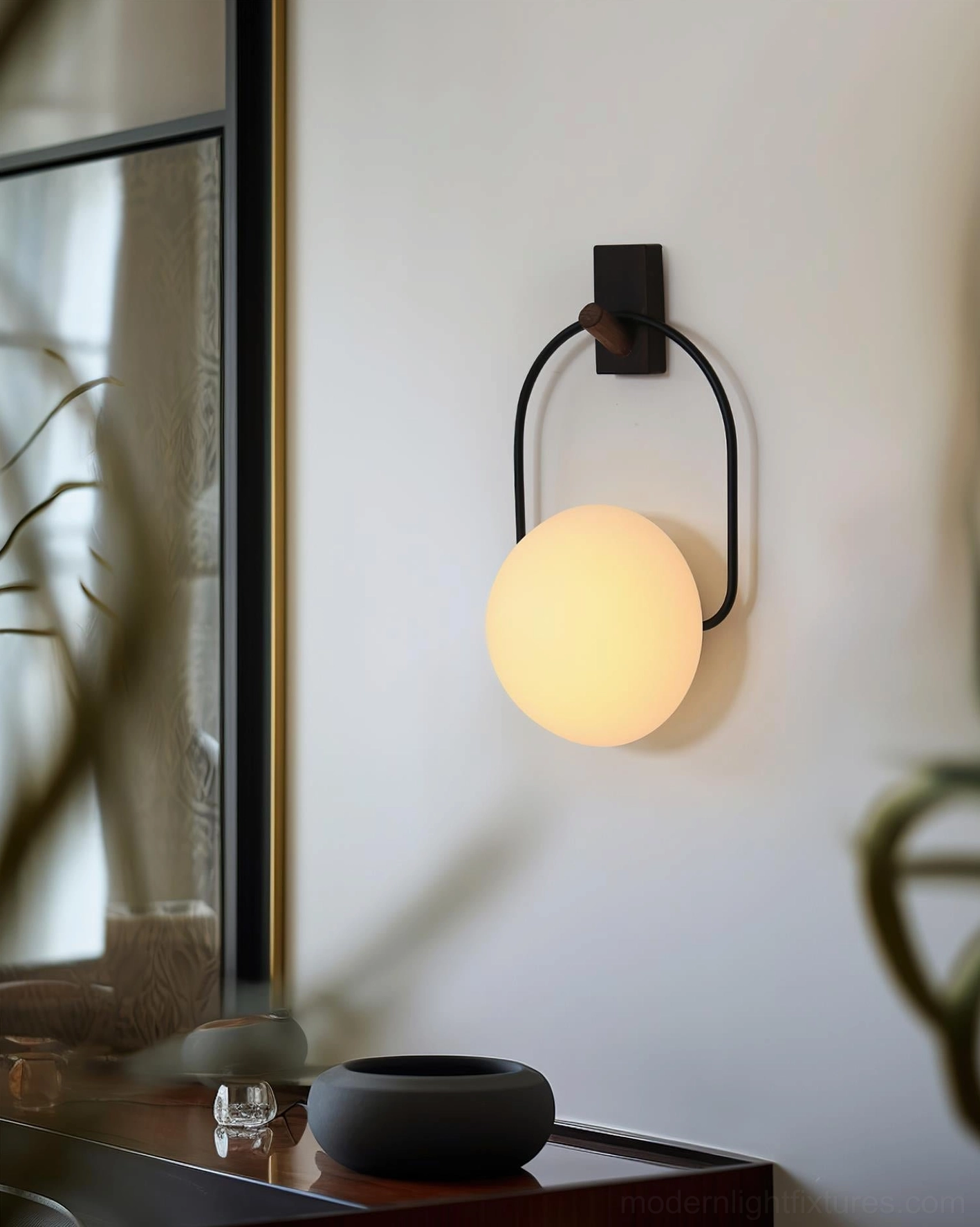 Zoe wall-mounted sconce light fixture, entryway hallway interior wall decoration, black metal bracket spherical shade