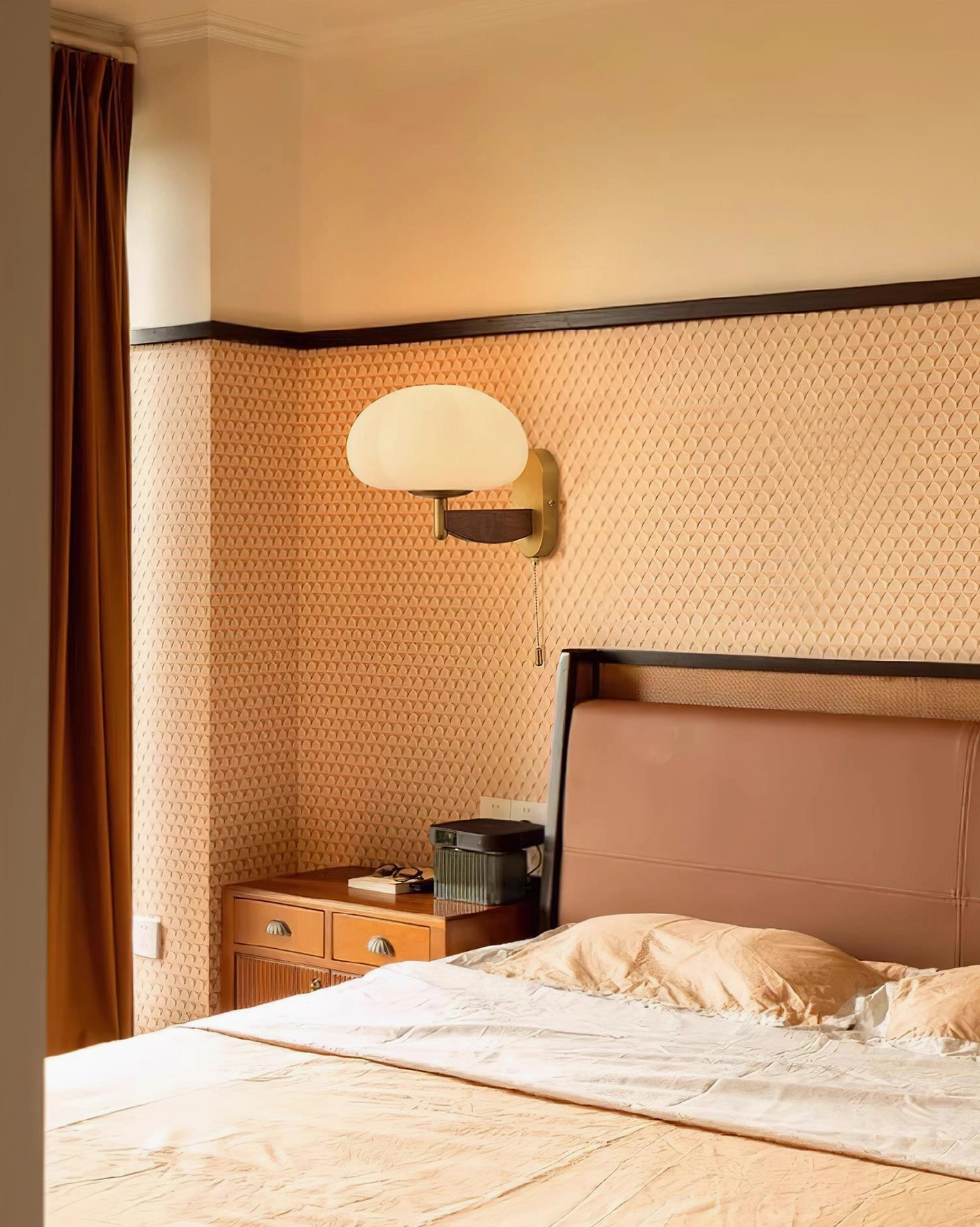 Boho vintage wall sconce in master bedroom above nightstand creating warm ambient lighting