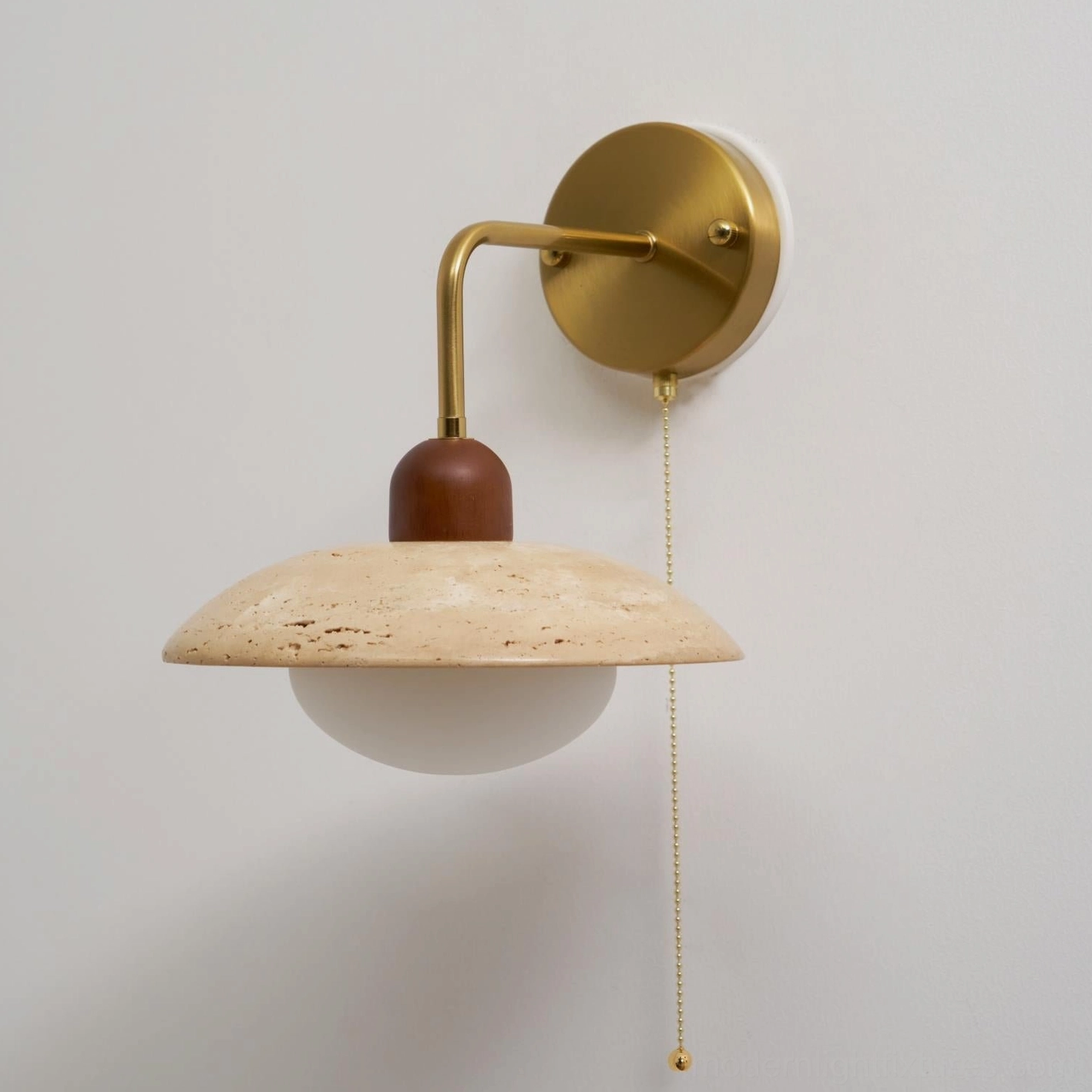 Wall sconce bottom view revealing frosted glass diffuser and internal light socket assembly