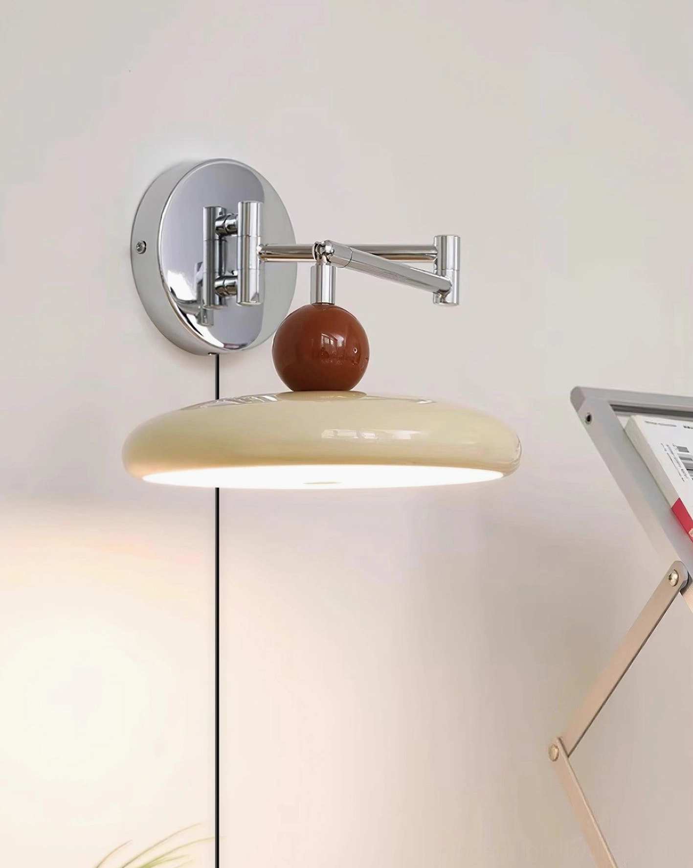 Plug-in wall lamp with multiple shade color variations shown: beige, white, olive green, and red options