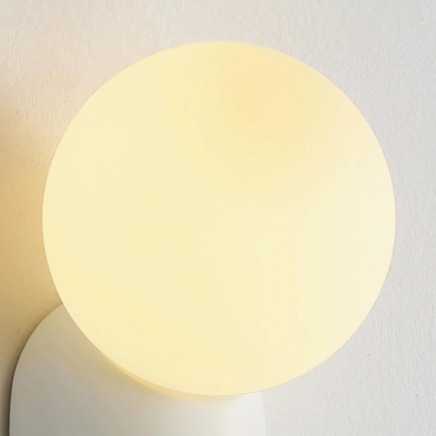Contemporary wall sconce installation in gallery-style arrangement as curated design statement piece
