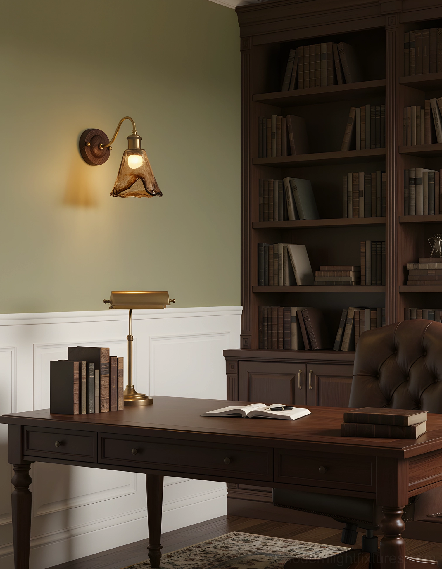 Contemporary amber glass wall lamp mounted on sage green accent wall in home study office environment