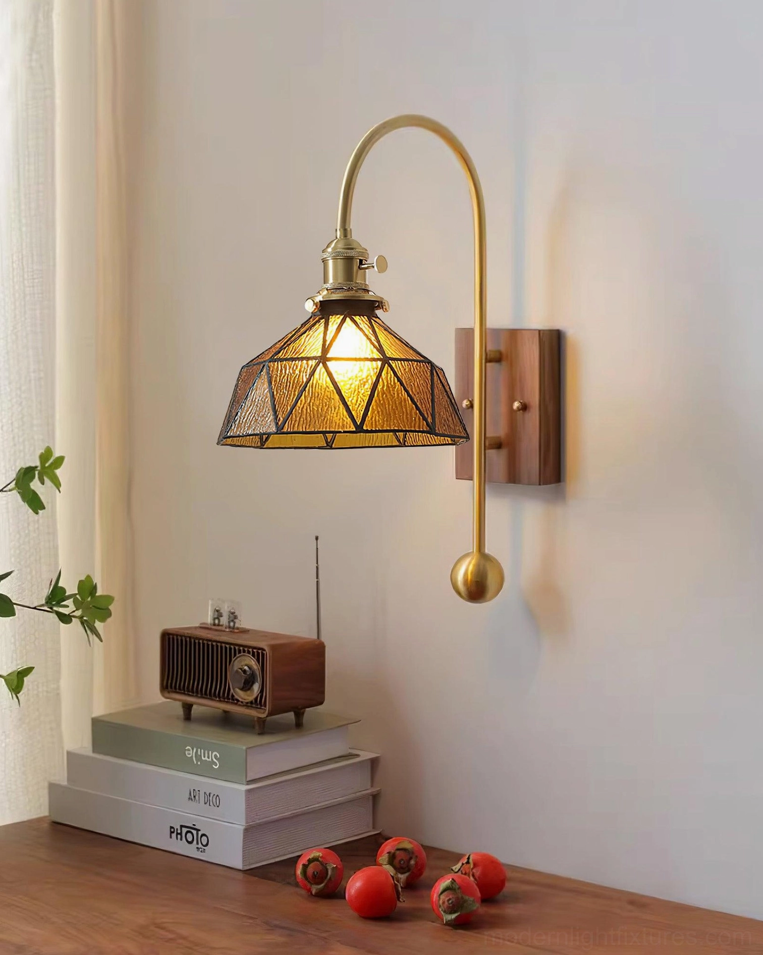 Stained glass wall sconce in cozy vintage home office setup with warm brass and walnut materials