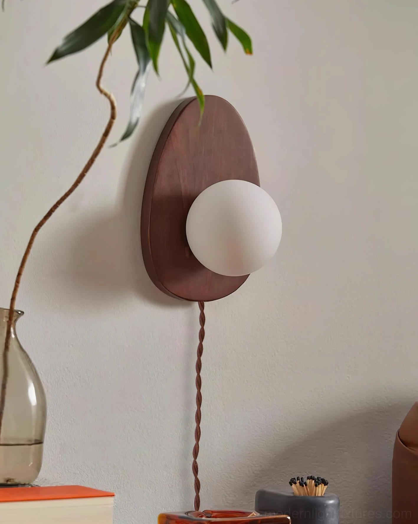 Wooden oval wall sconce backplate detail showing smooth finish and quality construction craftsmanship