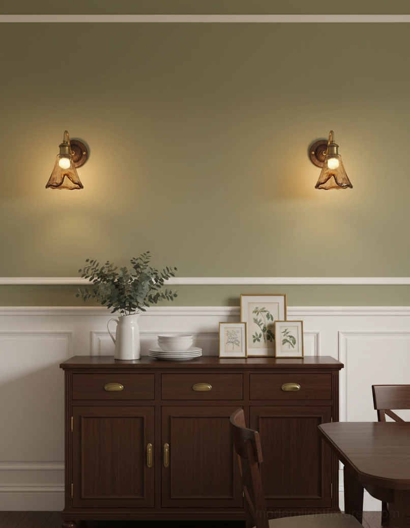 Contemporary wall lamp side profile detail of hand-rippled amber glass and brass mounting hardware