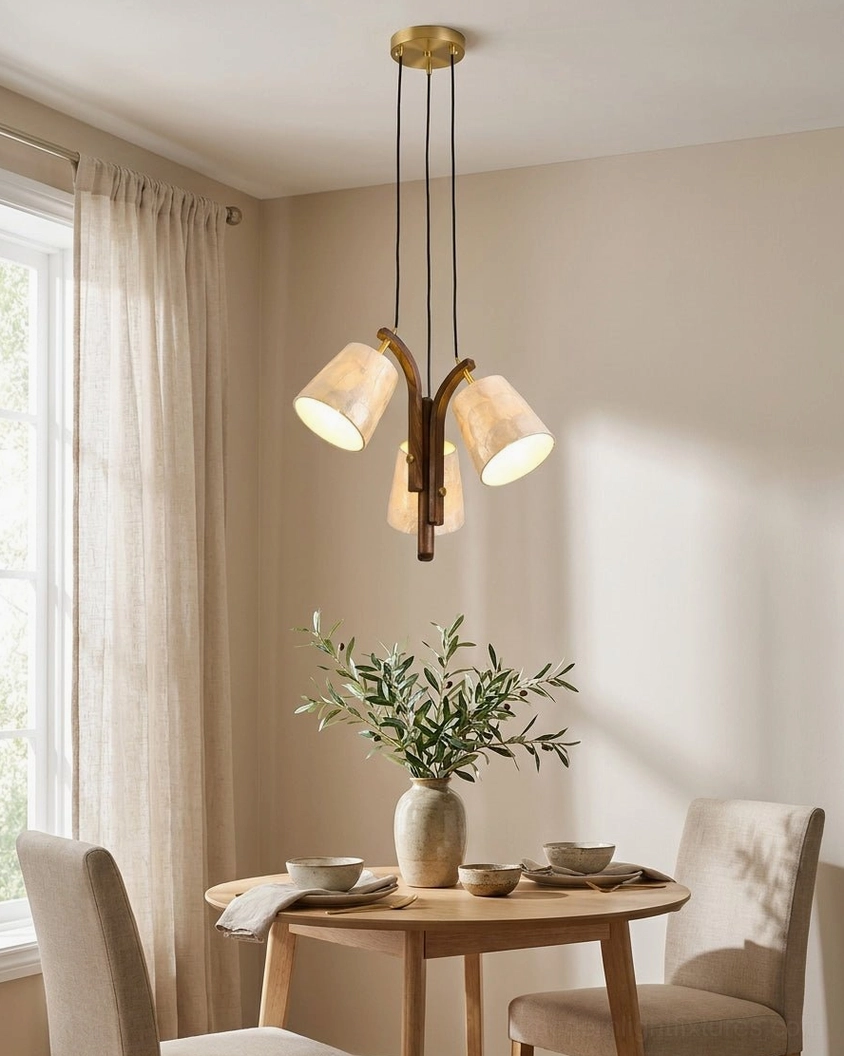 Walmere capiz shell pendant light suspended above modern dining table with neutral décor and warm ambient glow