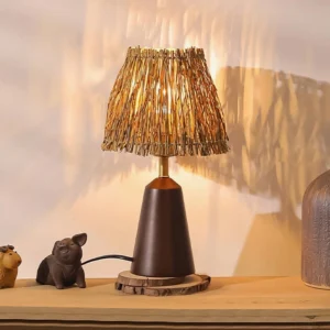 Rustic bohemian table lamp with walnut wood base and straw shade on wooden console table