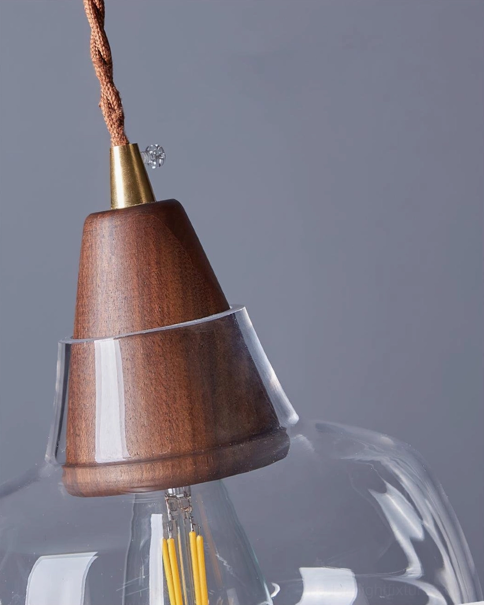 Contemporary walnut and brass glass pendant light fixture showing sloped ceiling compatible installation, Nordic home decor